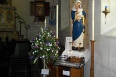 Our-Lady-With-Votive-Candles